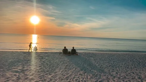 Two People on Beach Watching Sunset - Wide - Ft. Myers, FL - November 12, 2025 Stock Footage 321661393