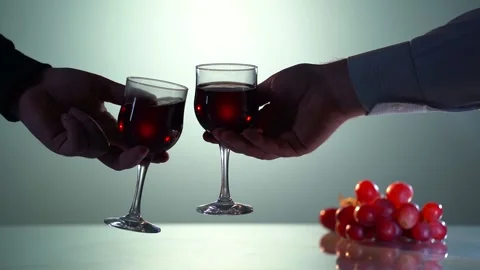 Two people chears of red wine glasses. Slow motion red and white wine pouring Stock Footage 151511461