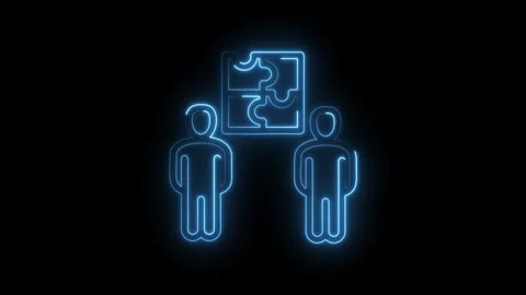 Two people collaborating on a puzzle solution with glowing blue neon outlines on Stock Footage 333963157