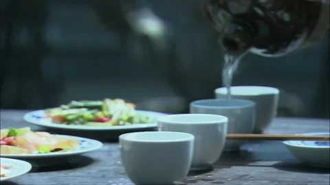 Two people competing in drinking at the wine table Stock Footage 261640705