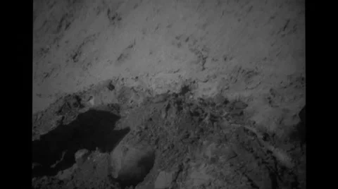 Two People covering bomb with mud Stock Footage 37594635