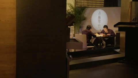 Two People Dining Together at Restaurant Table in Beijing, China Stock Footage 345763878
