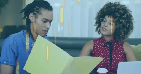 Two people discussing documents with data processing animation over them Stock Footage 303841514