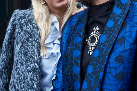 Two people dressed in chic jackets, mid section close up Stock Photos
