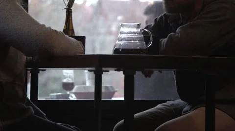 Two people drinking coffee at a Coffee Shop by a window-Meeting Stock Footage 47783807