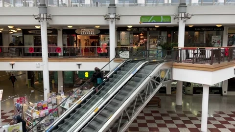 Two people on an escalator, Whitgift Centre, Croydon, 4K Stock Footage 171408883