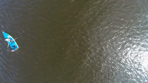 Two people floating on a boat on the river. aerial view 動画素材 63509117