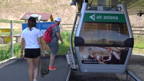 Two people getting on the cable car, Kazakhstan, HD, DNxHR 스톡 동영상 151413264