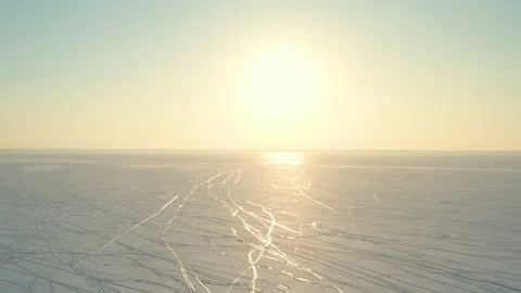 The two people going trough the snow field Stock Footage 189332078