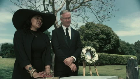 Two People grieving at a funeral Stock Footage 262300342