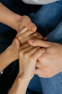 Two people hands in hands Stock Photos