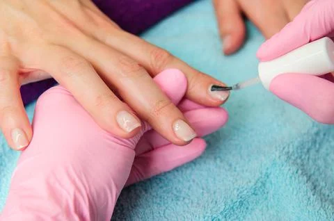 Two people holding hands for comfort.Hand care. Stock Photos