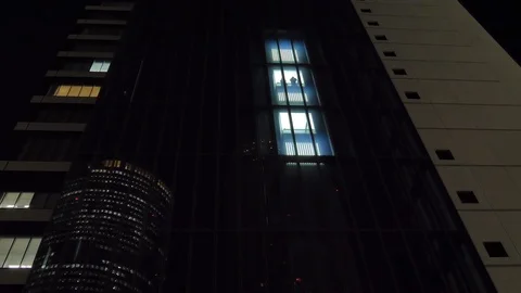 Two people inside the elevator going down so fast in Osaka Japan Stock Footage 125845236