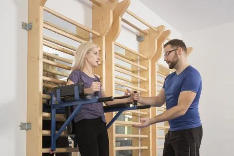 Two people, instructor showing educating fitness woman listening Stock Photos
