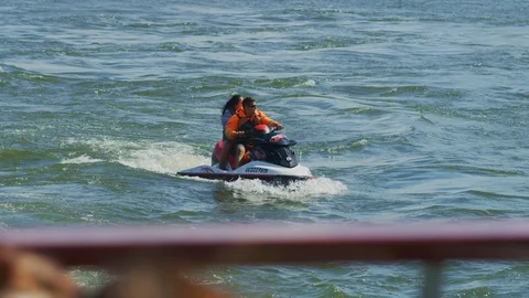 Two people on a jet ski Stock Footage 99921188
