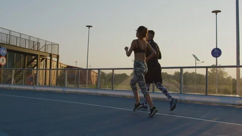 Two people jogging Stock Footage 100033547