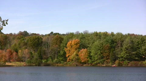 Two people kayaking in the fall Stock Footage 580672
