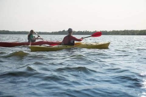 Two people in kayaks on the river Stock Photos