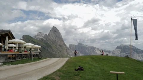 Two people with mountain bikes standing on the road 動画素材 204729176