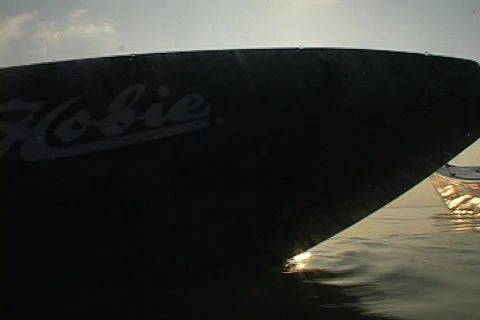 Two People Paddle Kayaks Into The Sunset - Kayak Underwater Stock Footage