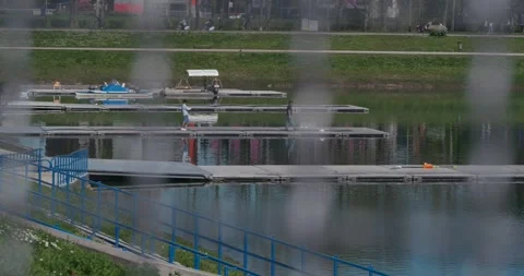 Two people photographing on floating docks Stock Footage 332550075