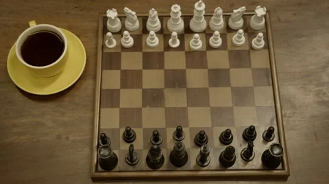 Two people playing chess on a beautiful antique cafe table Stock Footage 55553945
