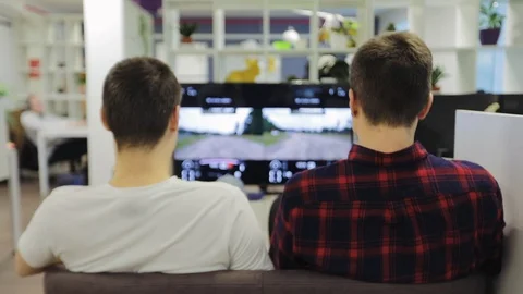 Two people playing console Stock Footage 123275385