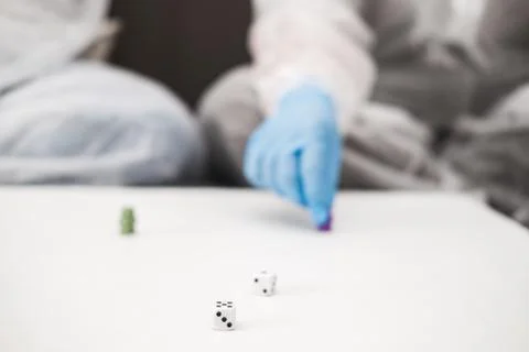 Two people in protective white translucent suit, blue rubber gloves, medical Stock Photos