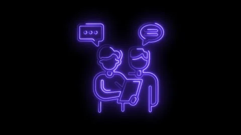 Two people reviewing data with neon glow speech bubbles on black background Stock Footage 330772954