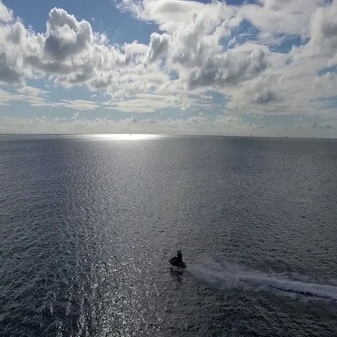 Two people riding on jet ski Stock Footage 69445519