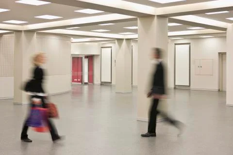 Two people rushing past each other Stock Photos
