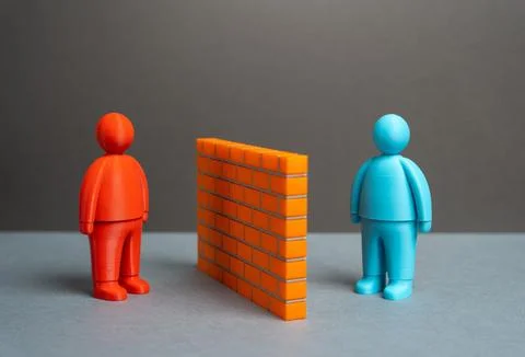 Two people separated by a brick wall. Misunderstandings and language barrie.. 写真素材
