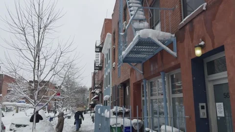Two People Sharing Umbrella Walking in Snow, Brooklyn Sidewalk, Blizzard Stock Footage 329888809