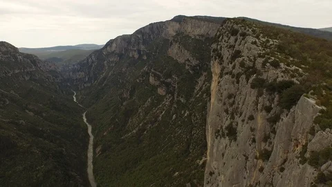 Two people sitting and talking on the top of cliff over a rocky gorge and a Video stock 101598317