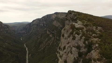 Two people sitting and talking on the top of cliff over a rocky gorge and a Video stock 101598689