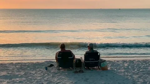 Two People Sitting on Beach Watching Sunset - Ft. Myers, FL - November 12, 2025 Stock Footage 321661402