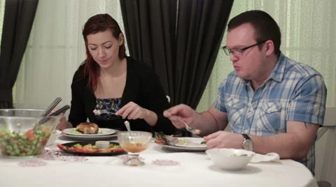 Two people sitting at the dinner table in a cafe Stock Footage 62847603