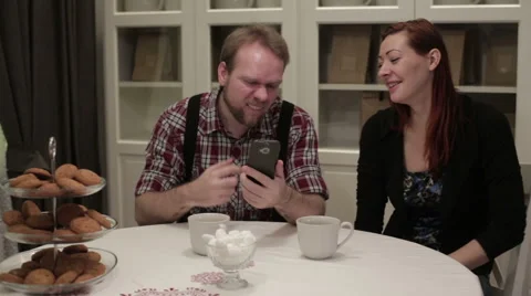 Two people sitting at the table doing selfie Stock Footage 62875056