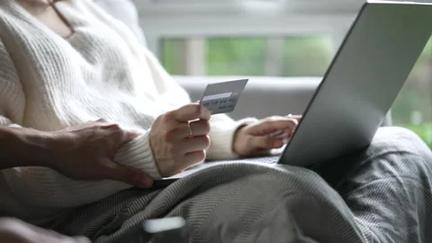 Two people sitting together, arguing about credit card for online shopping. Stock Footage 170734486