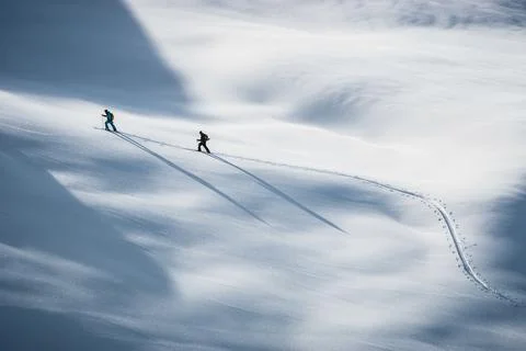 Two people skiing in the Alps, Lienz, Austria Stock Photos
