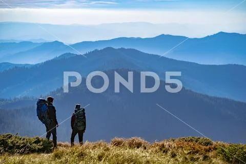 The two people standing on the mountain Stock Photos