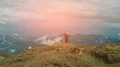 The two people standing on the mountain top with a beautiful view 4k or 4k+ Resolution