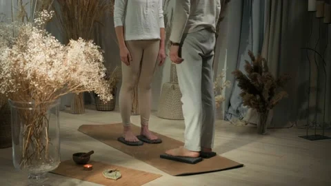 Two people standing on nails board in studio, meditation and stress relief Stock Footage 234983330