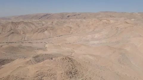 Two people standing on top of a hill in the desert, aerial, Israel 스톡 동영상 239759938