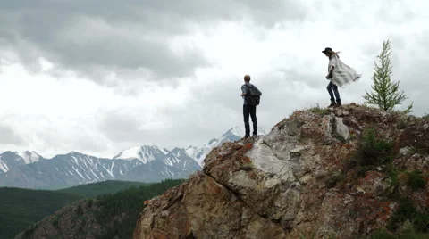 Two people standing on top of a mountain Stock Footage 65762186
