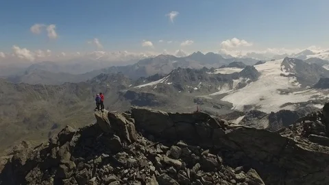 Two people standing on the top of a mountain, Verbier, Switzerland Video stock 101579949