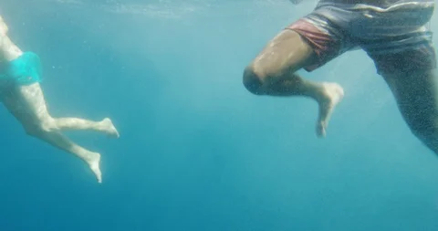 people swimming underwater