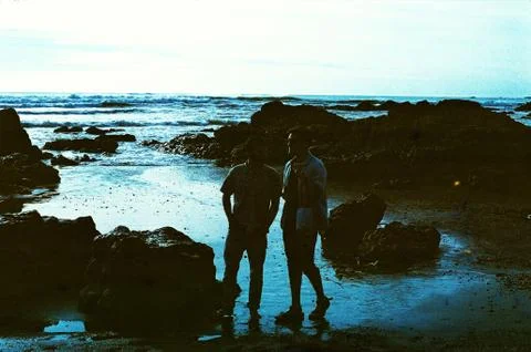 Two People Talking On Beach Stock Photos
