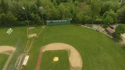 Two People Talking As They Walk Across Baseball Field Video stock 154610112