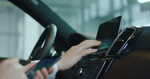 Two people testing on board computer in car Stock Footage 100551346